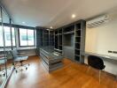 Spacious office space with large windows and modern furniture