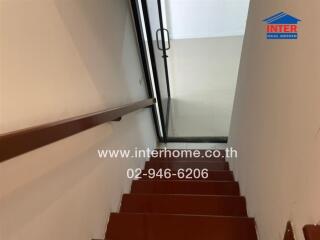 Interior view of a staircase with modern design and natural light