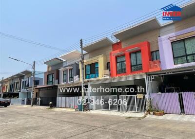 Colorful row of townhouses in a sunny residential area