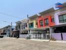 Colorful row of townhouses in a sunny residential area