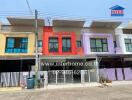 Colorful townhouse exteriors with individual garages