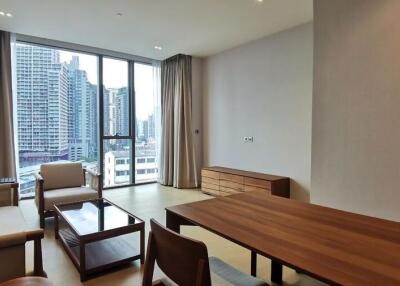 Modern living room with city view through large windows