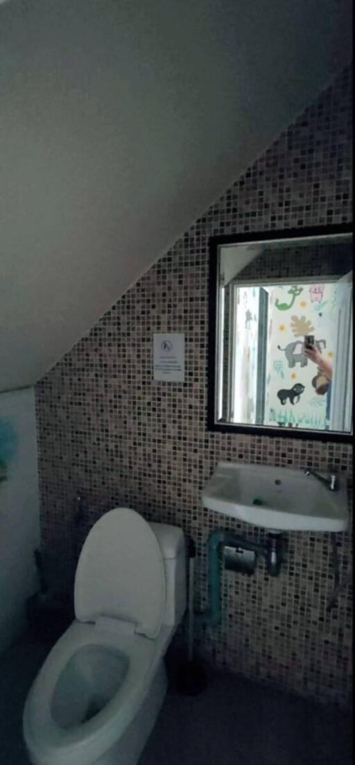 Compact bathroom with mosaic tiles