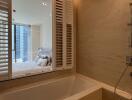 Modern bathroom with window view and bathtub