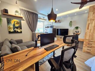 Modern and stylish living room with workspace and entertainment setup
