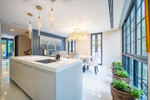 Modern spacious kitchen with dining area and large windows