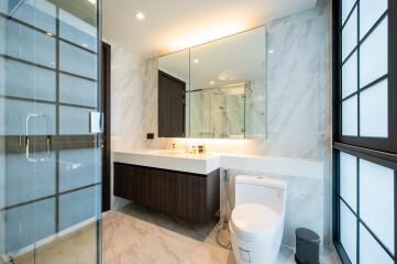 Modern bathroom with marble tiles and spacious design