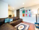 Stylish modern living room with leather sofa and vibrant wall art