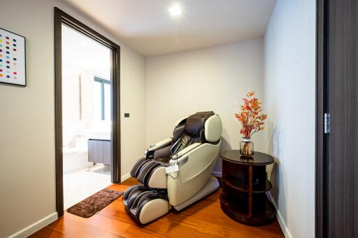 Modern bedroom with luxury massage chair and stylish decor
