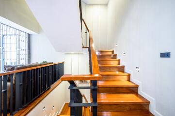 Modern wooden staircase with natural light
