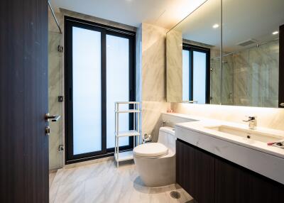 Modern bathroom with large windows and elegant fixtures