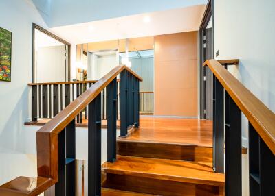 Spacious Hallway with Wooden Stairs and Modern Aesthetic