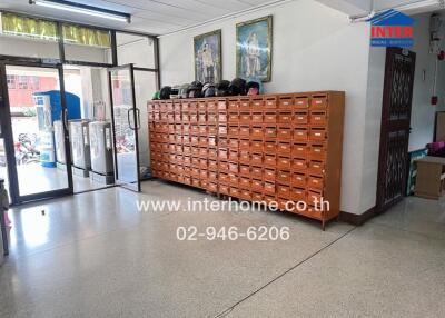 Spacious lobby area with large mailbox unit and secure entrance