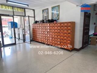 Spacious lobby area with large mailbox unit and secure entrance