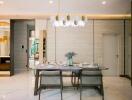 Elegant dining room with modern chandelier and stylish table setting