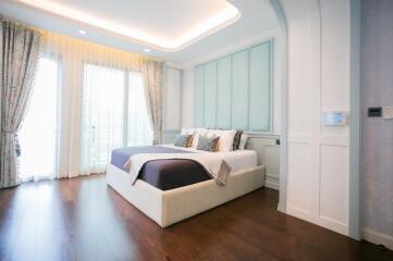 Elegant spacious bedroom with natural lighting