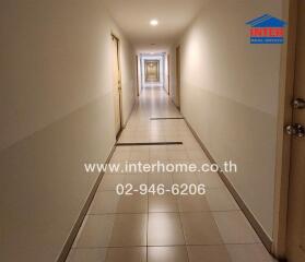 Long corridor in a residential building with tiled floor