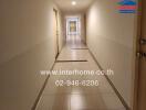 Long corridor in a residential building with tiled floor
