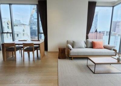 Modern living room with expansive windows overlooking the city