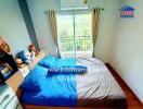 Spacious Bedroom with Large Window and Scenic View