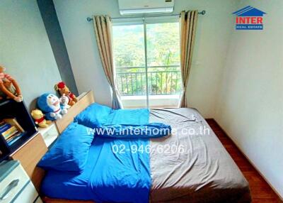 Spacious Bedroom with Large Window and Scenic View