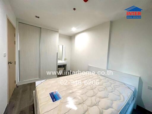 Spacious bedroom with large bed and built-in wardrobe