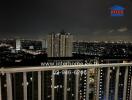 City view from high-rise balcony at night