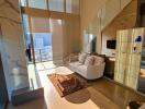 Elegant living room with natural light and luxurious finishes