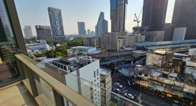 Panoramic city view from high-rise apartment balcony