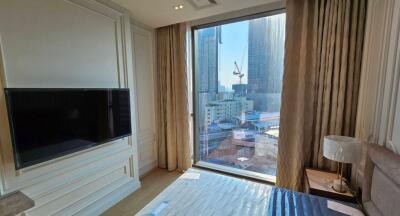 Modern bedroom with city view and ample natural light