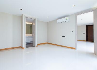 Spacious and bright empty bedroom with white walls and ample natural light