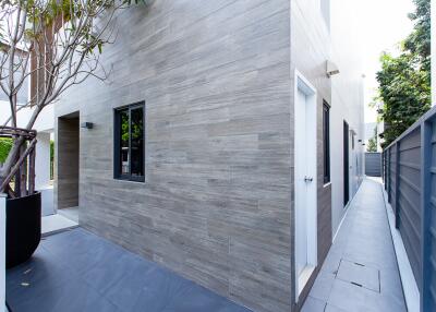 Modern house exterior with gray slate tiles and minimalist design