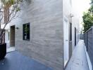 Modern house exterior with gray slate tiles and minimalist design