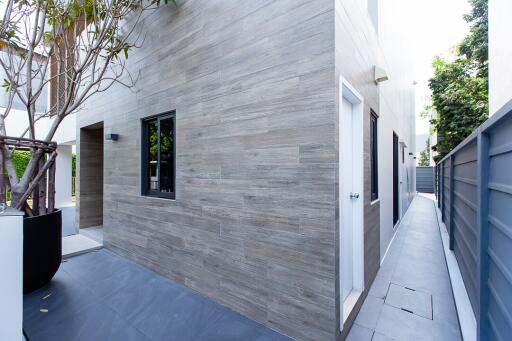 Modern house exterior with gray slate tiles and minimalist design