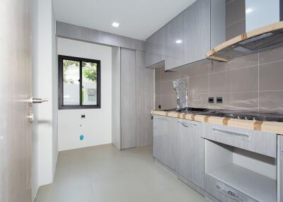 Modern kitchen with gray cabinetry and stainless steel appliances