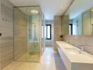 Modern spacious bathroom with dual sinks and large shower