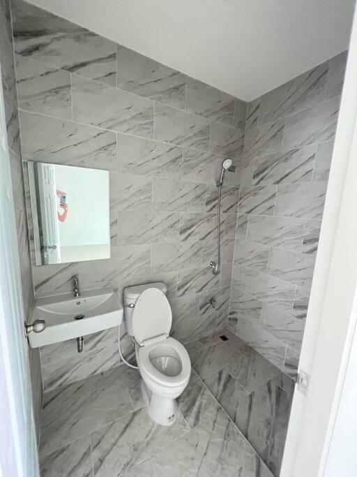 Modern bathroom with stylish tiled walls and sleek fixtures