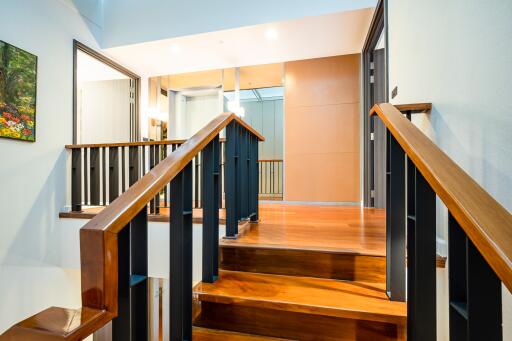 Elegant hallway with wooden staircase and modern design