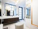 Modern bathroom with large mirrors and stylish lighting