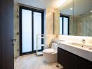 Modern bathroom with large windows and marble finishes