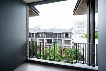 Spacious balcony with city view and protective railing