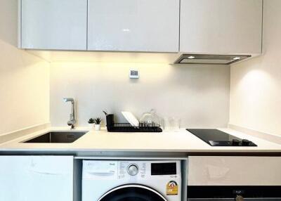 Modern kitchen with white cabinets and built-in appliances