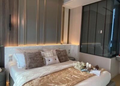 Modern bedroom with elegant decor and ambient lighting