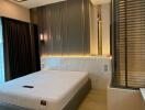 Modern bedroom with sleek design and ample lighting