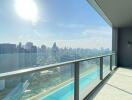 Spacious balcony with panoramic city view and safety glass railing