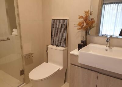 Modern bathroom with neutral tones and sleek fixtures
