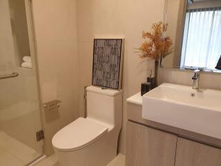 Modern bathroom with neutral tones and sleek fixtures