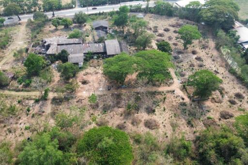 A large plot by the main road for sale in Sankhampeang, Chiang Mai