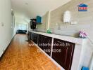 Spacious kitchen with modern amenities and wooden flooring