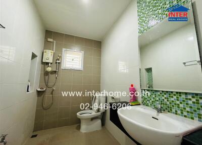 Modern bathroom with green mosaic tiles